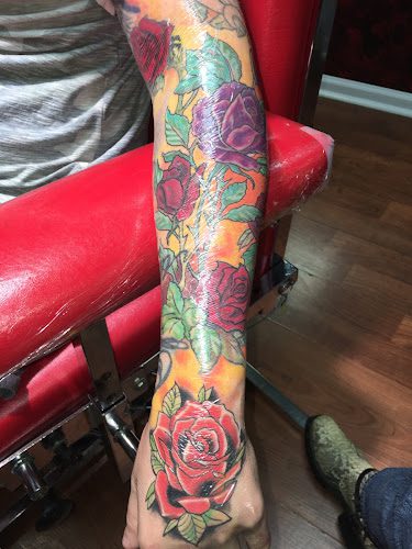 Devine Line Tattoos & Body Piercings